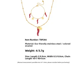 Detailed specs of gold stainless steel necklace set with red chili and clover charms