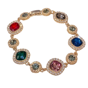 Vintage style gold bracelet with colorful rhinestones and geometric buckle design