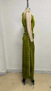 Detail of olive green velvet dress featuring hand-woven rope decor on the waist