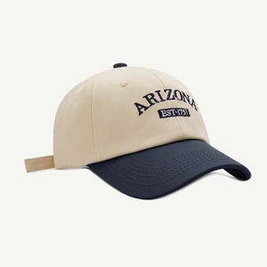 Detailed close-up of Arizona embroidery on a two-tone beige and navy baseball cap