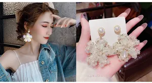 Detailed view of 925 silver needle snowflake tassel earrings with pearls and crystals