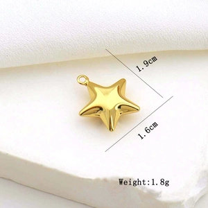 Macro view of gold star pendant showing dimensions 1.9cm by 1.6cm and weight 1.8g