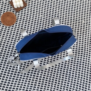 Top view of blue canvas ita bag showing internal pocket and grey ribbon handles