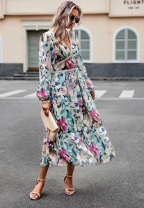 Detailed view of long sleeve V-neck floral dress with tiered ruffles and high waist