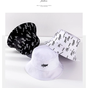 Detailed view of street style cotton canvas bucket hats with Thug Life outlaw prints