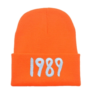 Orange 1989 embroidered knit beanie hat with ribbed texture for winter warmth