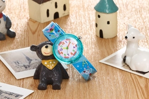 Detail of waterproof kids watch showing luminous quartz dial and blue cartoon strap