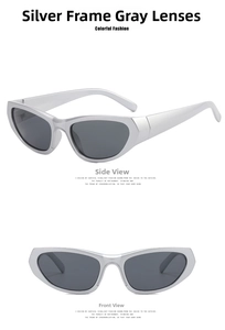 Close-up of Y2K futuristic silver metallic sunglasses with grey lenses and wide temples