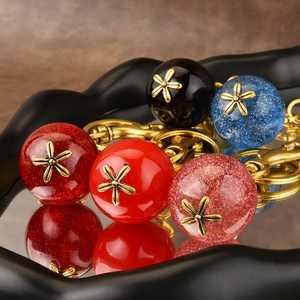 Sparkly resin apple keychain set in various colors with vintage gold floral metal caps