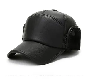 Close-up of black leather winter flat cap featuring thick thermal earflaps and fine texture