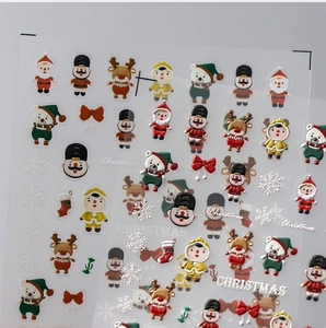 Detail view of 3D embossed Christmas nail stickers featuring Nutcracker and Reindeer