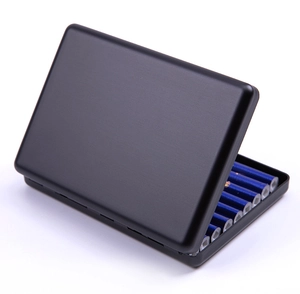 Macro detail of black aluminum cigarette case showing interior storage and matte finish