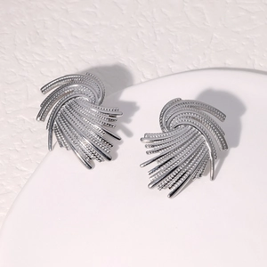 Vintage silver stainless steel stud earrings featuring irregular woven geometric design