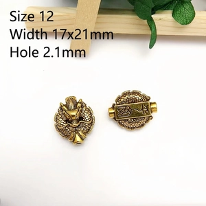 Detailed view of antique brass dragon bead DIY jewelry accessory with dimensions 17x21mm
