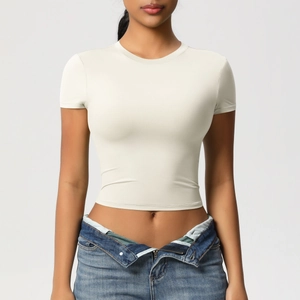 Detailed texture of slim fit quick-dry yoga t-shirt in cream white with crew neck
