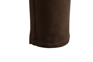 Macro view of thick twill fabric texture and double-stitched hem on dark brown trousers