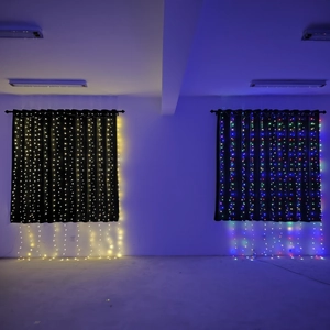 Detail view of hanging LED curtain string lights in warm white and RGB multicolor effects