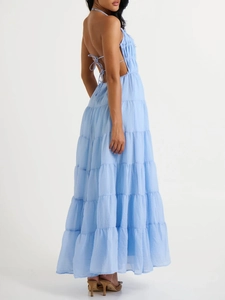 Detail of light blue backless halter maxi dress with layered ruffle tiered skirt