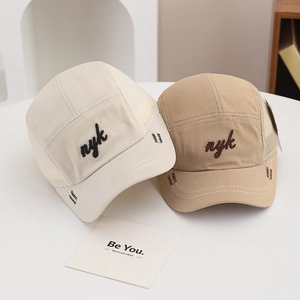 Detail of mesh side panels on NYK baseball caps for enhanced breathability and airflow