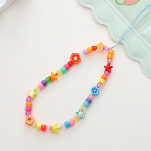 Detail of colorful acrylic beads and star charms on a vibrant Y2K style phone lanyard
