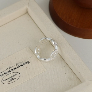 Detailed macro view of S925 sterling silver open ring with vintage engraved leaf patterns