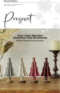Mini wooden Christmas trees in four colors with gold star toppers and rustic bases