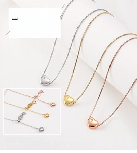 Detailed view of heart pendants with adjustable sliding clasp in silver, gold, and rose gold