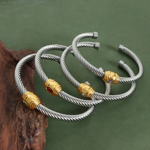 Twisted stainless steel cable open bangle featuring multicolor zircon gemstone accents