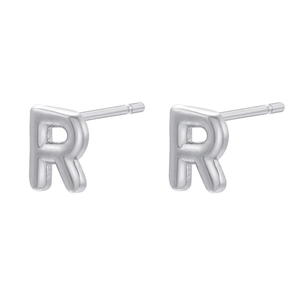 Detail view of smooth silver letter R studs in 18K gold plated polished metal