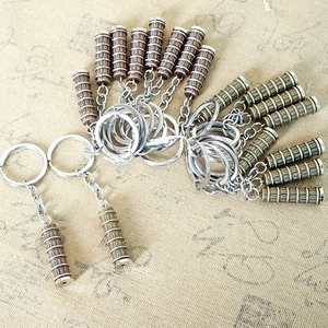 Detailed close-up of bronze metal Leaning Tower of Pisa souvenirs and keychains