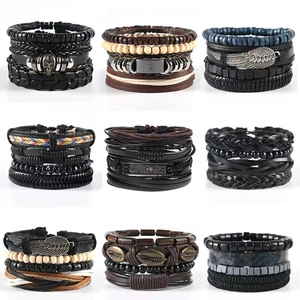Detail showing a variety of vintage leather multi-layer bracelets with beads and metal charms