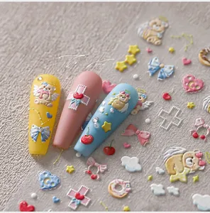 Detailed 3D embossed nail stickers featuring cute bears and colorful macaron motifs