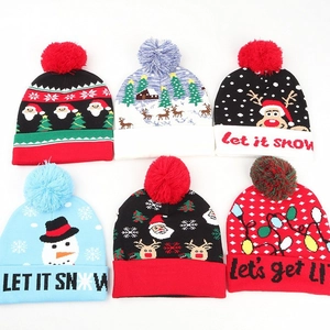 Winter Christmas knit hats featuring reindeer, snowman designs and colorful pom-poms
