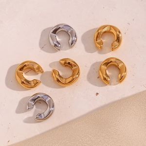Detail view of 18K gold and silver plated stainless steel C-shaped thick ear cuffs