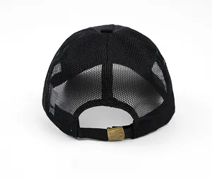 Detail of black mesh baseball cap back with antique bronze American flag buckle