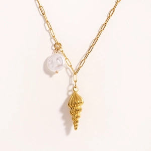 Gold titanium steel necklace featuring a conch pendant and white pearl on paperclip chain
