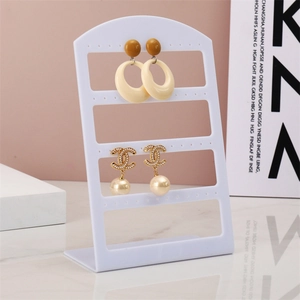 Minimalist white L-shaped 48-hole acrylic jewelry display stand for earrings storage