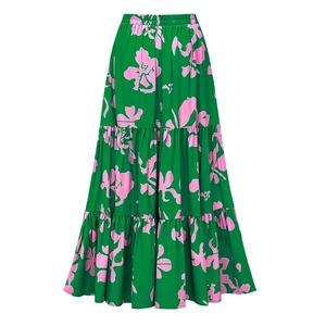 Detail of tiered emerald green midi skirt with pink floral print and elastic waist