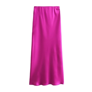 Detail view of the rose pink satin maxi skirt showing soft silk texture and glossy finish