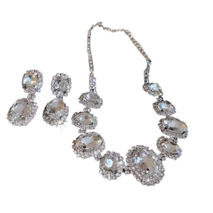 Elegant French oval crystal necklace and earrings set in polished silver finish