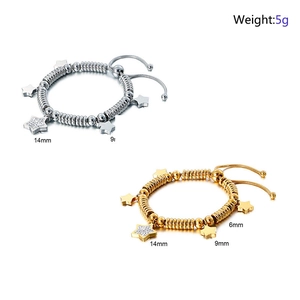 Detail of silver and gold star charm bracelets showing 6mm 9mm and 14mm size options