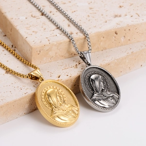 Religious necklace set with gold and silver Virgin Mary oval pendants on stone base