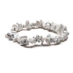 Macro shot of white marble textured crystal chips on an elastic handmade bracelet