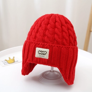 Red cable knit trapper hat for children with ear flaps and square numeric fashion patch