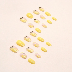 Summer yellow oval press-on nails featuring fresh lemon slice art and glossy finish