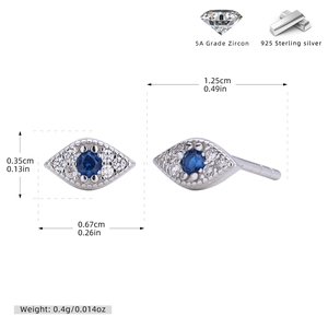 Detailed macro view of S925 sterling silver evil eye stud earrings with blue cubic zirconia