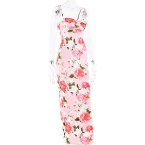 Detailed close-up of pink floral dress featuring rose print and delicate thin straps