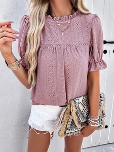 Detail of pink hollow lace top with ruffle sleeves and stylish crochet patterns
