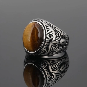 Vintage men's stainless steel ring featuring oval tiger eye stone with engraved patterns