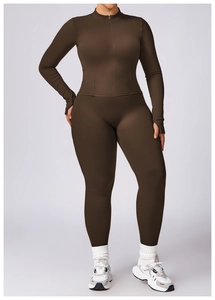 Detail view of deep brown high-stretch fitness set with slim-fit jacket and seamless leggings